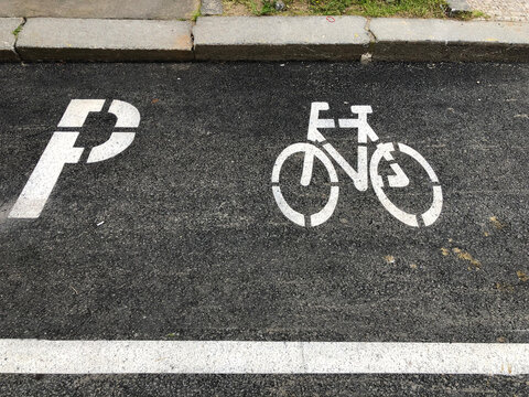 Bicycle parking sign painted on the street