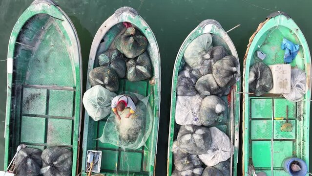 A fishman works on the boats, aerial view