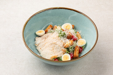 Portion of gourmet caesar salad with chicken