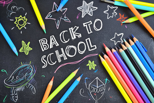 text "BACK TO SCHOOL" on Black Chalkboard Background
