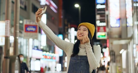 Heart, hands and selfie by Japanese woman in a city for travel, adventure or journey outdoor. Love,...