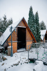 Wooden gazebo covered with snow. Winter weekend in the countryside, outdoor recreation concept