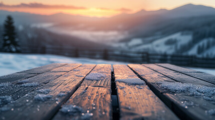 Naklejka na ściany i meble The empty wooden table top with snow and frost for your decoration of product or text and landscape of winter mountains with small rural home and sunset time