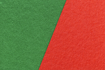 Texture of craft red and green paper background, half two colors, macro. Vintage dense kraft cardboard