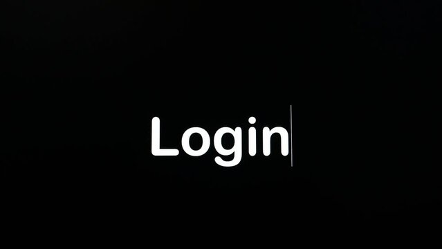 Writing on the screen with a flashing paragraph forming the word Login, in white on a black background