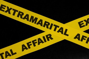 Extramarital affair crime scene, caution and warning concept. Yellow barricade tape with word in dark black background.