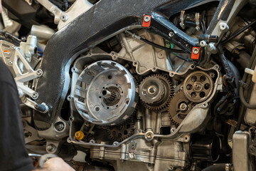 Vibrant snapshots capture the skilled artistry at a motorcycle repair workshop—mechanics in action, tools gleaming, and the hum of reviving engines