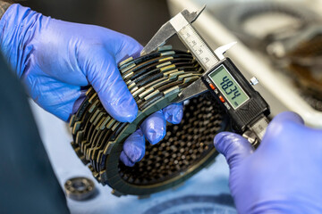 Vibrant snapshots capture the skilled artistry at a motorcycle repair workshop—mechanics in...