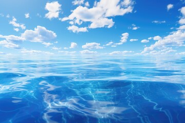 Fototapeta premium Split view clear blue underwater ocean the horizon and blue sky with clouds