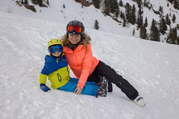 Fototapeta na wymiar Happy family, enjoying ski holiday with children, sunny beautiful weather