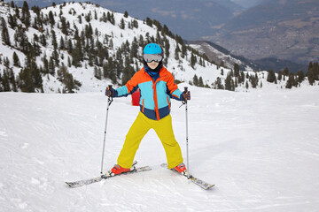 Happy family, enjoying ski holiday with children, sunny beautiful weather