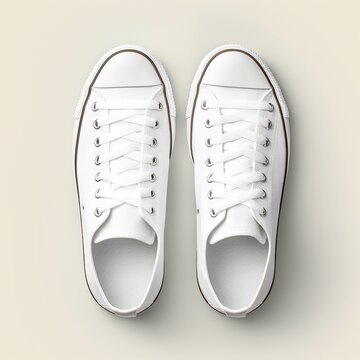 Mockup photo of white sneakers with top view on beige background