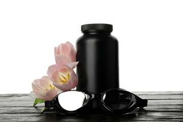PNG, swimming goggles and pill bottle with flowers, isolated on white background.