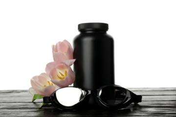 PNG, swimming goggles and pill bottle with flowers, isolated on white background.