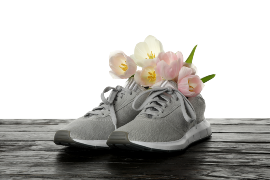 PNG sports goods with flowers on table isolated on white background.