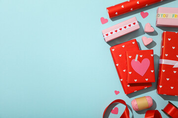 Red gifts on a blue background, concept for Valentine's Day.