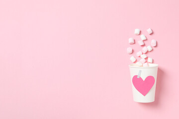 A heart made of sweet candies on a light background.