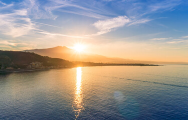 Fototapeta na wymiar picturesque view to a sunset sea gulf with beautiful mountains and amazing cloudy sky on background of nice travel landscape