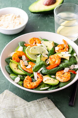 Salad with shrimps, avocado, spinach and almonds. Healthy eating. Diet.