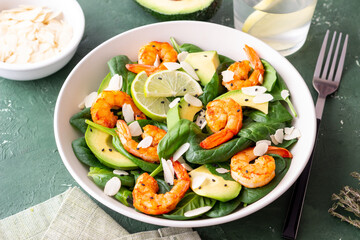 Salad with shrimps, avocado, spinach and almonds. Healthy eating. Diet.