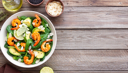 Salad with shrimps, avocado, spinach and almonds. Healthy eating. Diet.