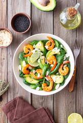 Salad with shrimps, avocado, spinach and almonds. Healthy eating. Diet.