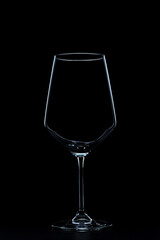 silhouette of wine glasses on black background