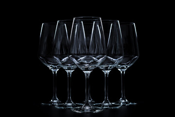 silhouette of wine glasses on black background