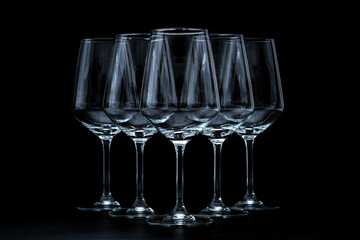 silhouette of wine glasses on black background