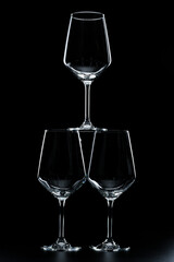 silhouette of wine glasses on black background
