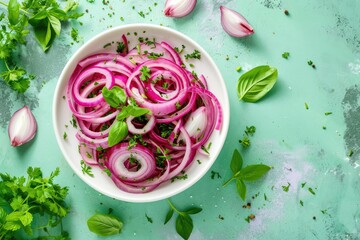 Healthy fermented food Top down view of pickled red onion rings fresh herbs white bowl Green background - obrazy, fototapety, plakaty