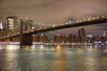 Brooklyn Bridge at night in winter. New York City, United States