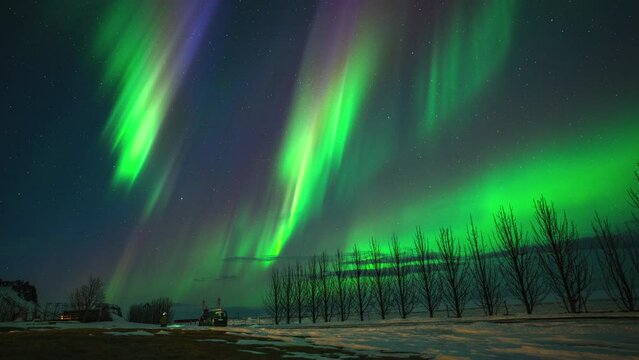 Norther Lights with stars in motion in Iceland at night, Aurora green loop winter