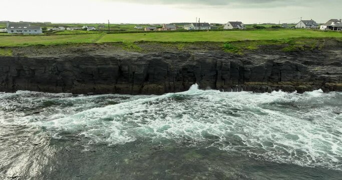 Ocean waves wash the rocky shore, wild atlantic way 4k