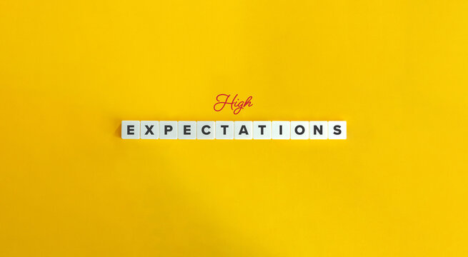 High Expectations Phrase. Letter Tiles on Yellow Background. Minimalist Aesthetics.