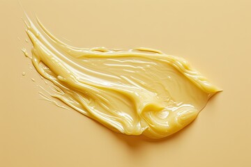 Yellow vaseline on beige background smudged liquid gel cosmetic