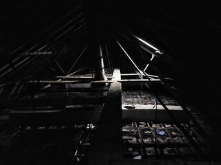 Dark and creepy attic with little daylight - 712235358