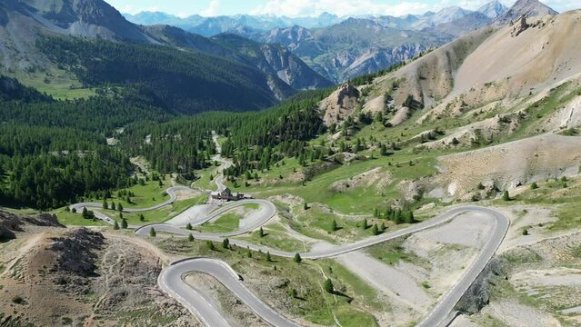 Scenic Road with Hairpin turns at Col Izoard Mountain Pass in French Alps, France - Aerial 4k