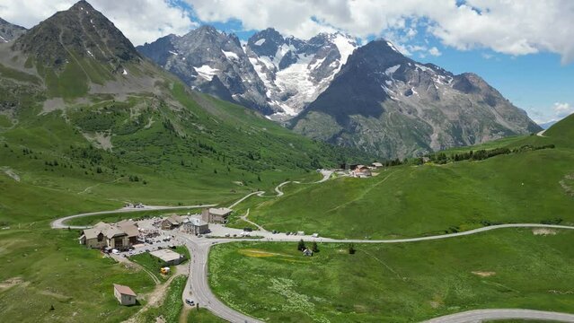 Col du Lautaret Mountain Pass and La Meije Peaks in French Alps, France - Aerial 4k