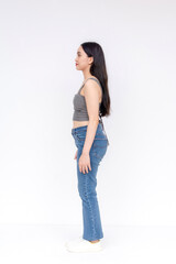 A poised young Asian female in casual attire presents a side profile. Suitable for diverse visual narratives.