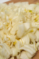 Chopped onion on wooden board