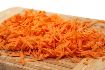 Grated carrot on white background