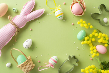 Prepping for Easter magic: top view of bright eggs, a cute bunny, baking gear, mimosa flowers, and...