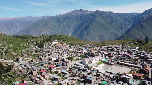 Colca Canyon, Peru: Aerial drone footage of the Cabanaconde town with the colonial San Pedro de Alcantara church in the Colca Canyon in the Andes mountains in Peru in south America