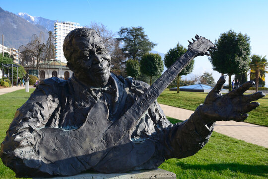 Montreux, Vaud, Switzerland, Europe - B.B. King bronze bust by Marco Zeno in Montreux Palace Gardens next to Miles Davis Hall, 4 star Hotel Eurotel in background, Lake Geneva shore