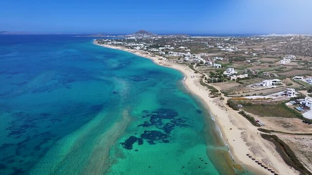 Aerial view of the beautiful Plaka area with sandy beaches and emerald sea at Naxos island, Cyclades, Greece