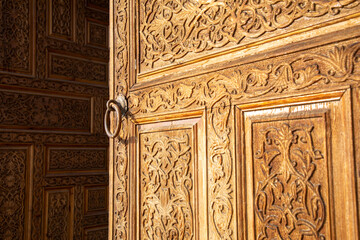 beautiful wooden door design in a historical fashion in the entrance of a historical place