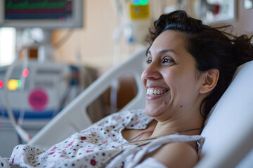 A female patient lying in a hospital bed smiling - obrazy, fototapety, plakaty