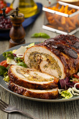 Stuffed turkey breast. Roasted whole, served with fresh vegetables.