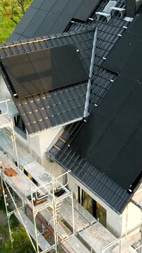 Flight Over a Newly Built Single-Family Home With Solar Panels on the Roof